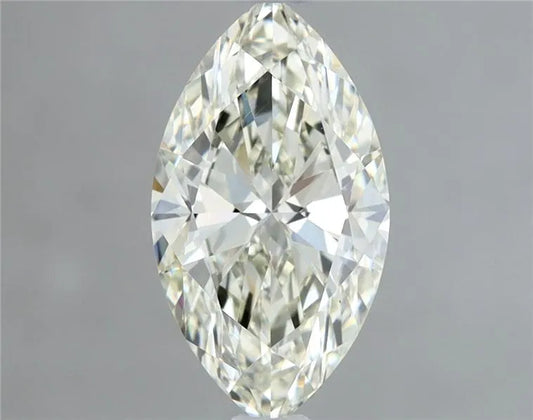 Close-up of a marquise-cut diamond showing its elongated shape and pointed ends against a neutral background.