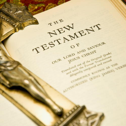 An open Bible with illustrated gemstones on the page, symbolising biblical gemstones and their theological meaning.