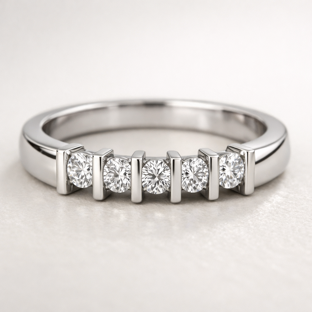 Close-up of a bar-set diamond engagement ring with vertical metal bars holding the diamonds on a neutral background