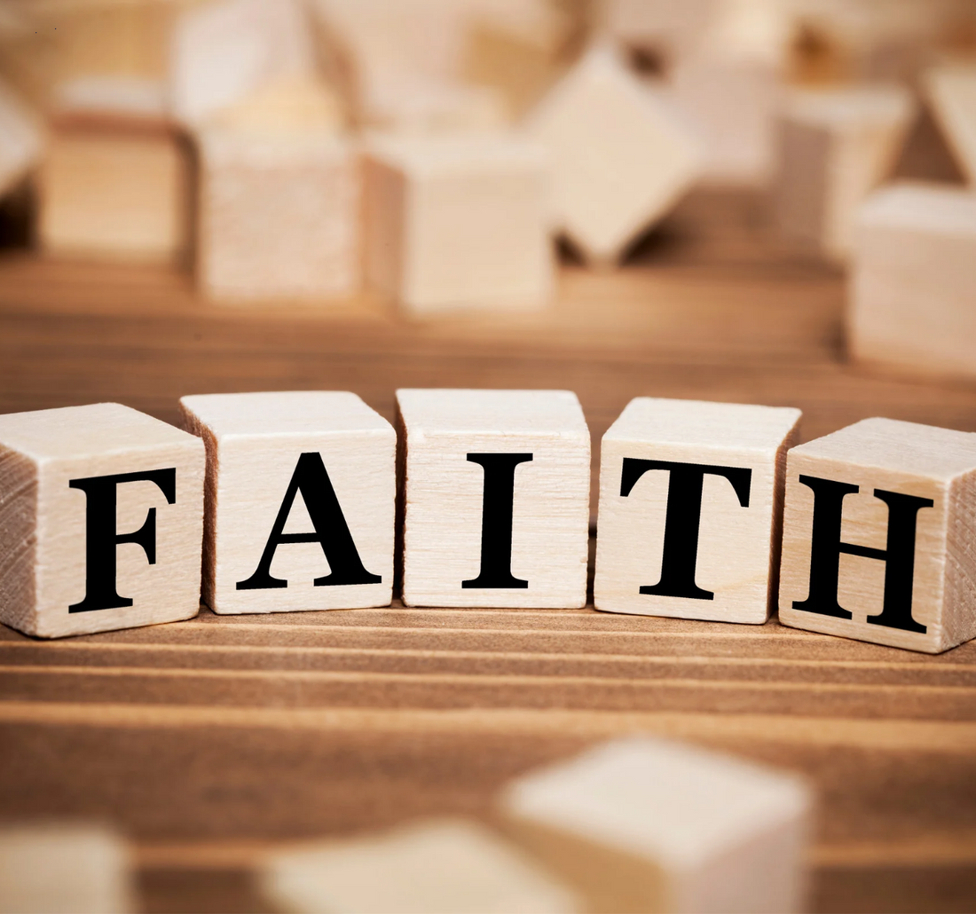 Wooden blocks with letters spelling the word FAITH