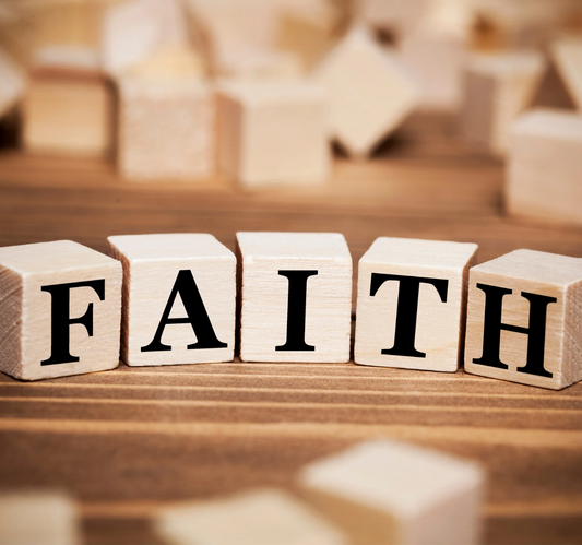 Wooden blocks with letters spelling the word FAITH