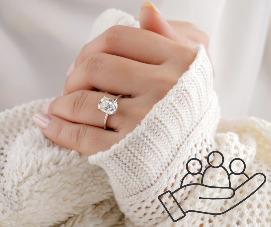 Lady wearing engagement ring with logo of justice next to it