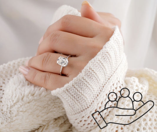 Lady wearing engagement ring with logo of justice next to it
