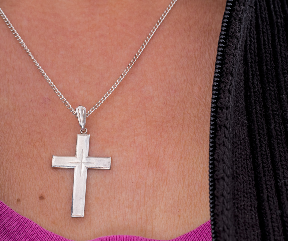 Lady wearing a Christian cross necklace