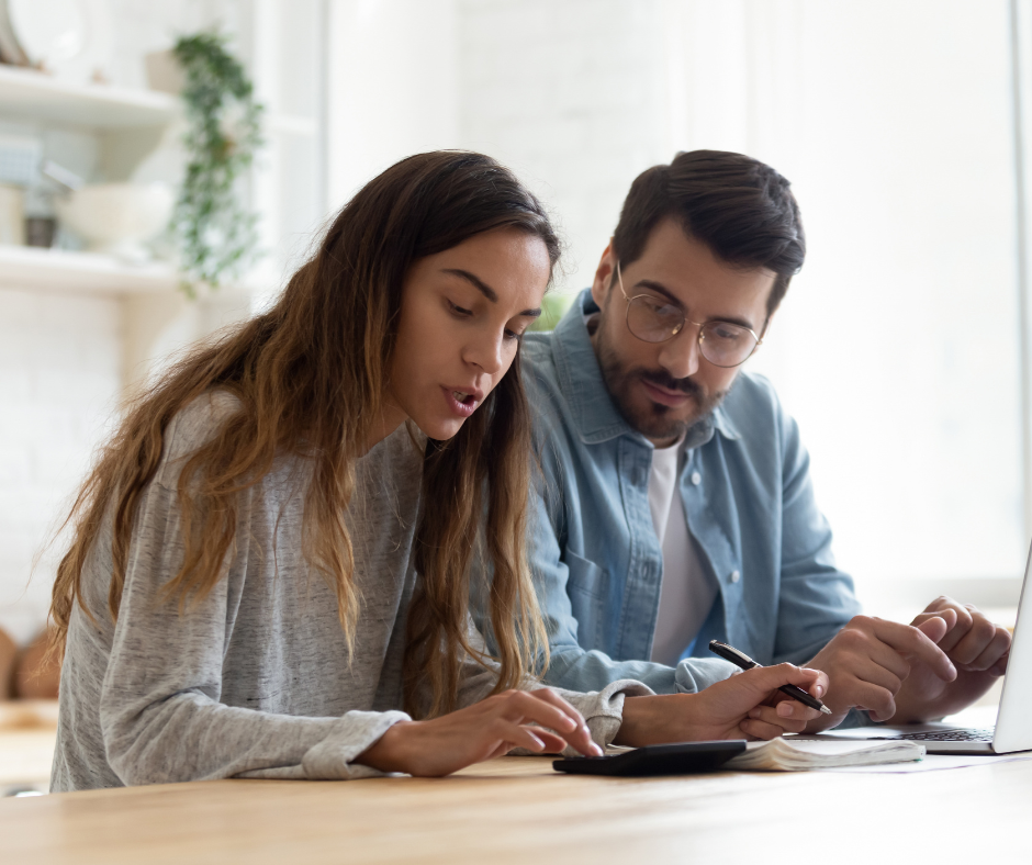 Couple sitting down working out budget