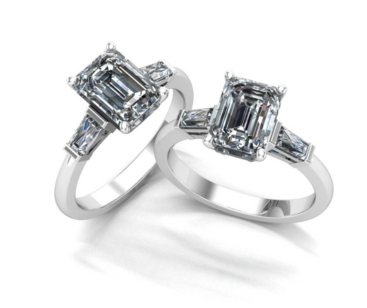 Two emerald cut diamonds set in two rings