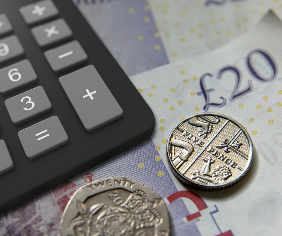 Someone with calculator working ring finance out