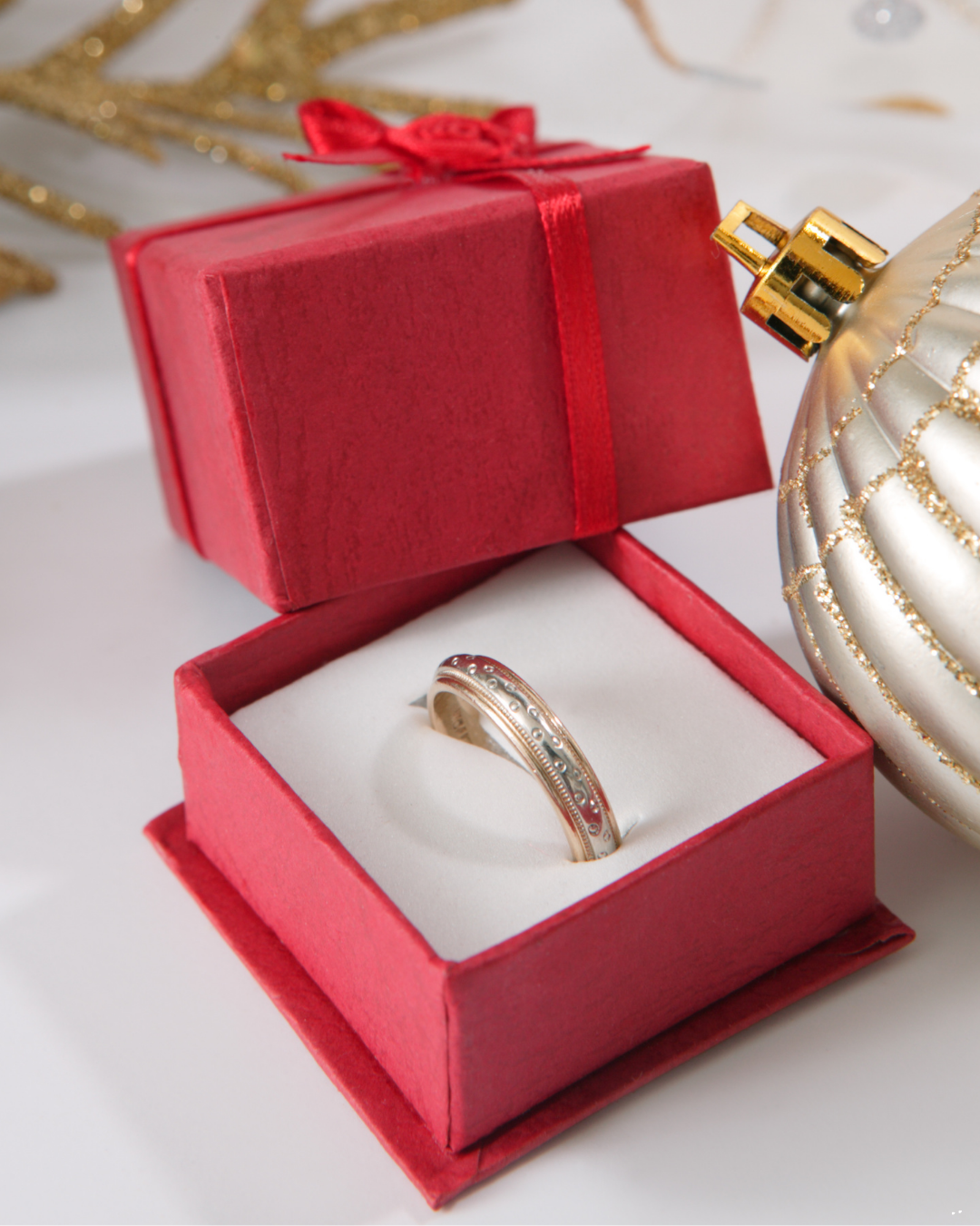 Christmas themed ring box opened and ring present inside