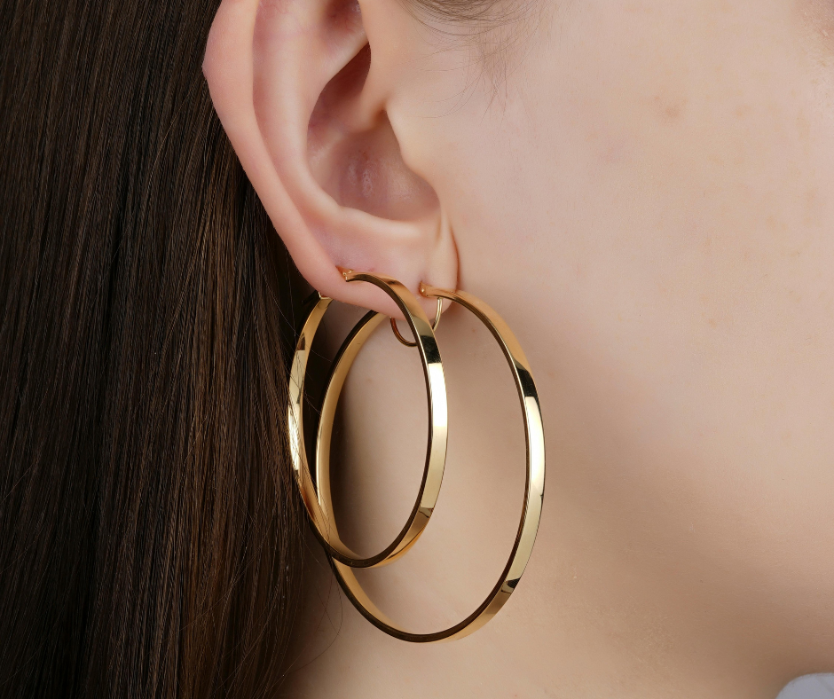 Lady with 2 hoop earrings in her ears