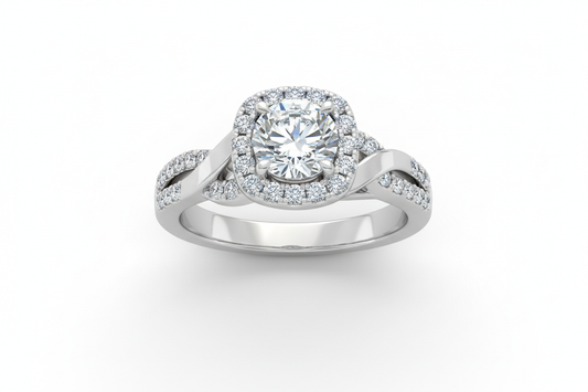 Close-up of a halo diamond engagement ring with a pavé band on a white background under soft lighting