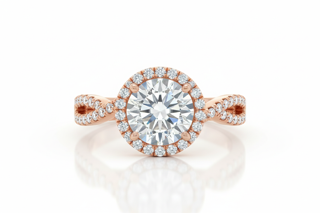 Close-up of a round halo diamond engagement ring with a rose gold band and pavé halo on a light background under soft lighting