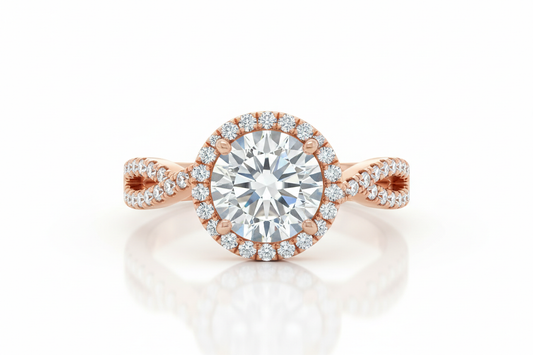 Close-up of a round halo diamond engagement ring with a rose gold band and pavé halo on a light background under soft lighting